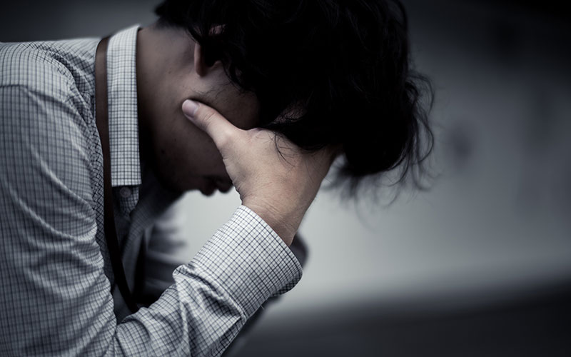 man stressed out at work