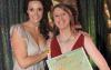 Actress Sarah Parish (left) presents the Southampton Echo Curtain Call Best Musical Director (South Coast region) award to Louise Helyer (right)