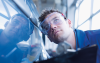 Technician inspecting car. CREDIT_iStock-88583403