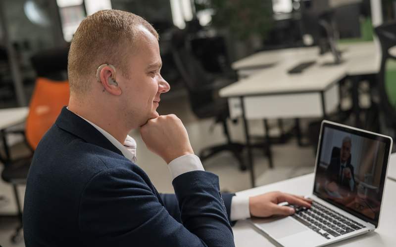 Hard of hearing disabled man at online meeting ©Reshetnikov Art, Shutterstock